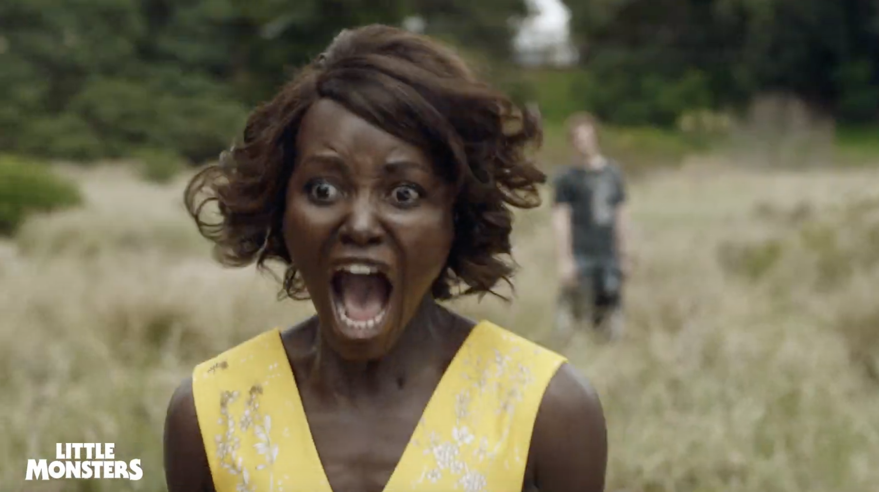 Red Band Trailer: Lupita Nyong’o Fights Off Zombies In Little Monsters